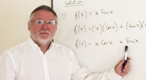 George teaching at a whiteboard